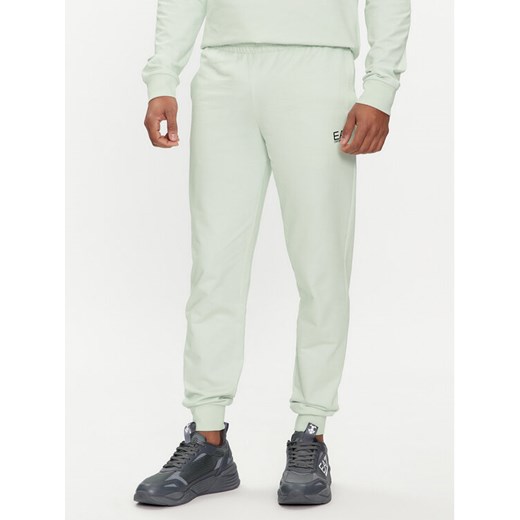 EA7 Emporio Armani Spodnie dresowe 8NPP53 PJ05Z 1133 Zielony Slim Fit ze sklepu MODIVO w kategorii Spodnie męskie - zdjęcie 183578535