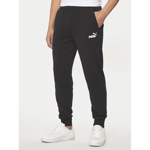Puma Spodnie dresowe Ess Logo 586716 Czarny Regular Fit ze sklepu MODIVO w kategorii Spodnie męskie - zdjęcie 183612429