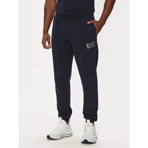 EA7 Emporio Armani Spodnie dresowe 6DPP59 PJSHZ 1562 Granatowy Regular Fit ze sklepu MODIVO w kategorii Spodnie męskie - zdjęcie 183613139