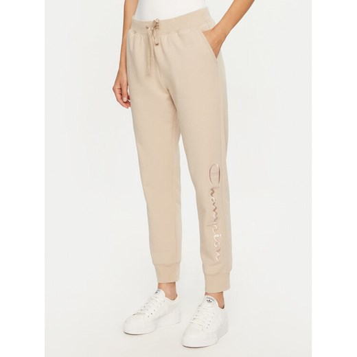 Champion Spodnie dresowe 117584 Beżowy Slim Fit ze sklepu MODIVO w kategorii Spodnie damskie - zdjęcie 183620508