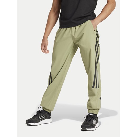 adidas Spodnie dresowe Future Icons 3-Stripes IW8549 Zielony Regular Fit ze sklepu MODIVO w kategorii Spodnie męskie - zdjęcie 183660308