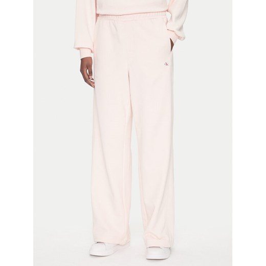 Calvin Klein Jeans Spodnie dresowe LV047C249G Różowy Regular Fit ze sklepu MODIVO w kategorii Spodnie damskie - zdjęcie 183706345