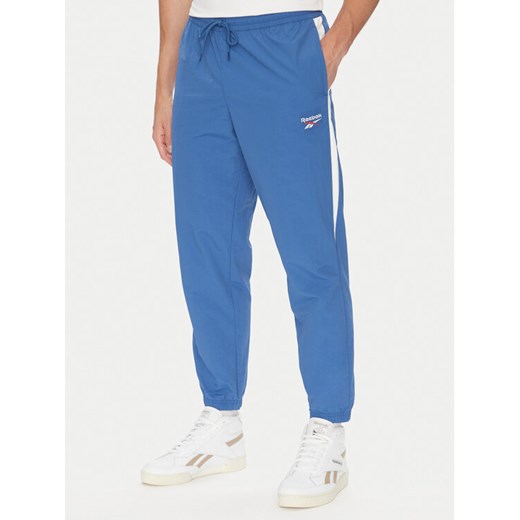 Reebok Spodnie dresowe 100215278 Niebieski Regular Fit ze sklepu MODIVO w kategorii Spodnie męskie - zdjęcie 183725089