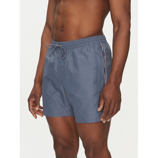 Calvin Klein Swimwear Szorty kąpielowe KM0KM01109 Niebieski Regular Fit ze sklepu MODIVO w kategorii Kąpielówki - zdjęcie 183737178