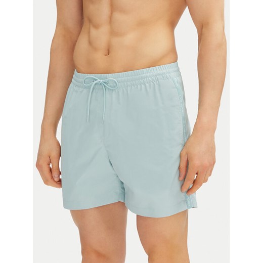 Calvin Klein Swimwear Szorty kąpielowe KM0KM01109 Niebieski Regular Fit ze sklepu MODIVO w kategorii Kąpielówki - zdjęcie 183737249