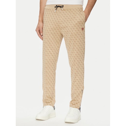 Guess Spodnie dresowe Korbin Z2BB05 FL04Q Beżowy Regular Fit ze sklepu MODIVO w kategorii Spodnie męskie - zdjęcie 183765145