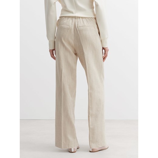 OPUS Spodnie w kolorze beżowym Opus 38 okazja Limango Polska