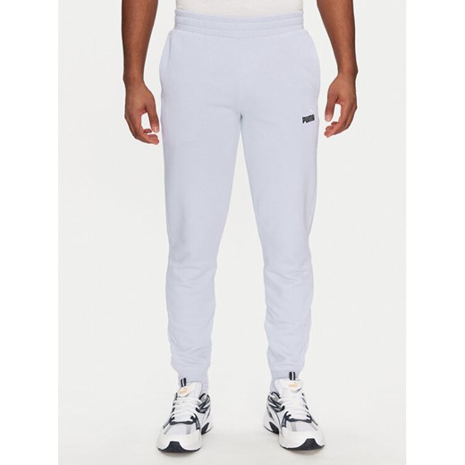 Puma Spodnie dresowe Ess 684714 Fioletowy Regular Fit ze sklepu MODIVO w kategorii Spodnie męskie - zdjęcie 183813229