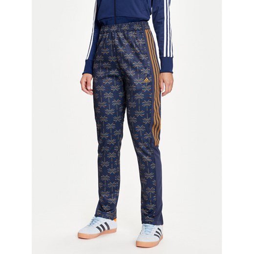 adidas Spodnie dresowe FARM Rio Tiro IV9754 Granatowy Regular Fit ze sklepu MODIVO w kategorii Spodnie damskie - zdjęcie 183840808