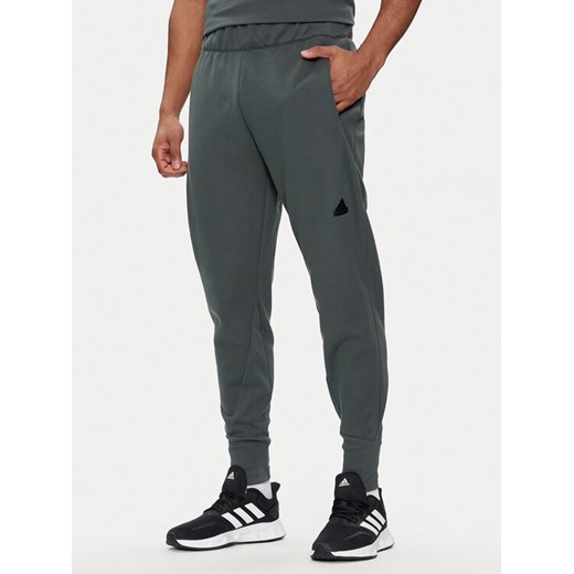 adidas Spodnie dresowe Z.N.E. Winterized IR5244 Zielony Regular Fit ze sklepu MODIVO w kategorii Spodnie męskie - zdjęcie 183885668
