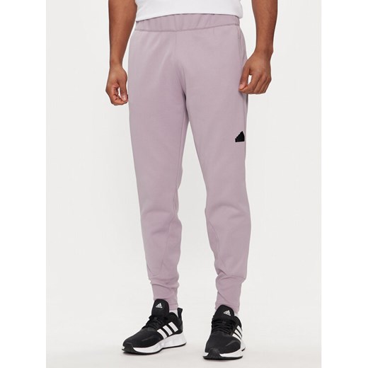 adidas Spodnie dresowe Z.N.E. Winterized IR5245 Fioletowy Regular Fit ze sklepu MODIVO w kategorii Spodnie męskie - zdjęcie 183885669
