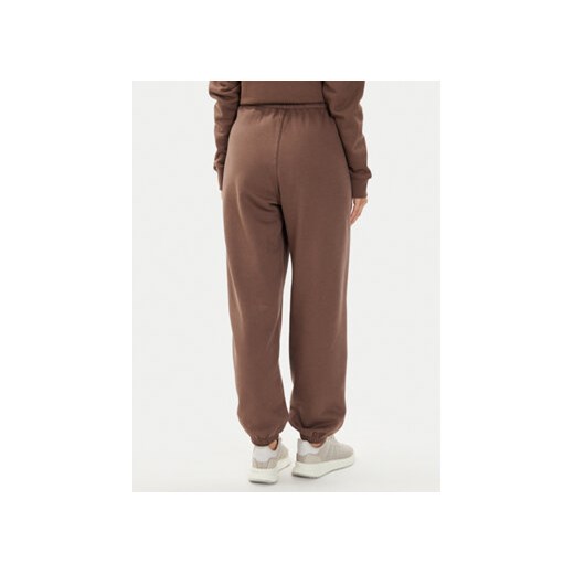 adidas Spodnie dresowe adicolor Essentials IR5974 Brązowy Regular Fit M MODIVO