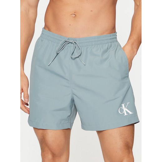 Calvin Klein Swimwear Szorty kąpielowe KM0KM01161 Błękitny Regular Fit ze sklepu MODIVO w kategorii Kąpielówki - zdjęcie 183938188