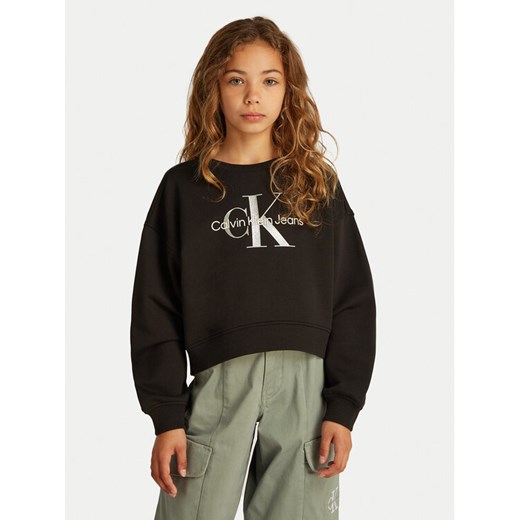 Calvin Klein Jeans Bluza Glitter Monologo IG0IG02823 M Czarny Boxy Fit ze sklepu MODIVO w kategorii Bluzy dziewczęce - zdjęcie 183945016