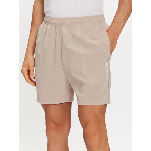 adidas Szorty sportowe Terrex Multi HZ6308 Beżowy Regular Fit ze sklepu MODIVO w kategorii Spodenki męskie - zdjęcie 183945525