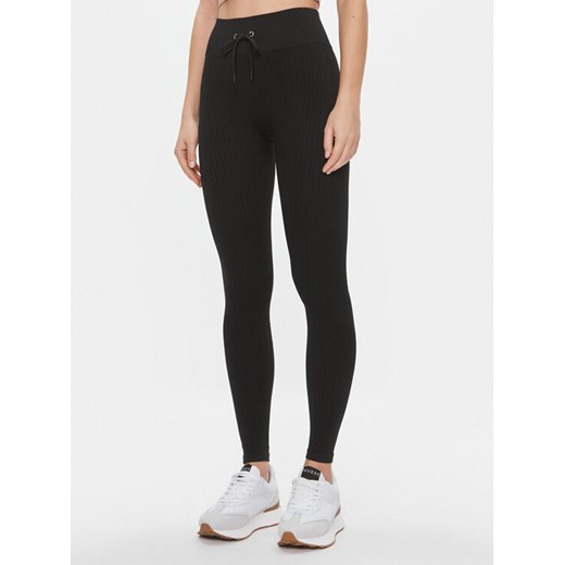 Guess Legginsy Rib-Seamless V4RB00 Z3CC0 Czarny Slim Fit ze sklepu MODIVO w kategorii Spodnie damskie - zdjęcie 183946395