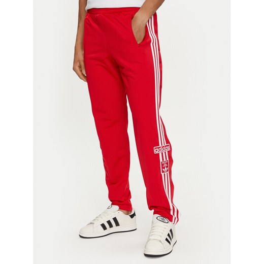 adidas Spodnie dresowe adicolor Classics Adibreak IM8221 Czerwony Regular Fit ze sklepu MODIVO w kategorii Spodnie męskie - zdjęcie 183946695