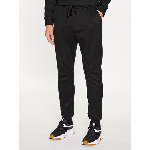 Boss Spodnie dresowe Hadiko Mirror 50501206 Czarny Relaxed Fit ze sklepu MODIVO w kategorii Spodnie męskie - zdjęcie 183947619