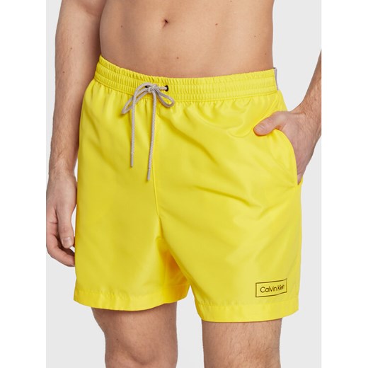Calvin Klein Swimwear Szorty kąpielowe KM0KM00787 Żółty Regular Fit ze sklepu MODIVO w kategorii Kąpielówki - zdjęcie 183985218