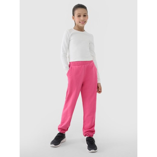 Dziewczęce spodnie dresowe joggery 4F 4FJWSS25TTROF0950 - różowe ze sklepu Sportstylestory.com w kategorii Spodnie dziewczęce - zdjęcie 184004528