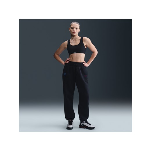 Damskie spodnie piłkarskie o kroju oversize z wysokim stanem Nike Anglia Phoenix Fleece - Czerń ze sklepu Nike poland w kategorii Spodnie damskie - zdjęcie 184006965