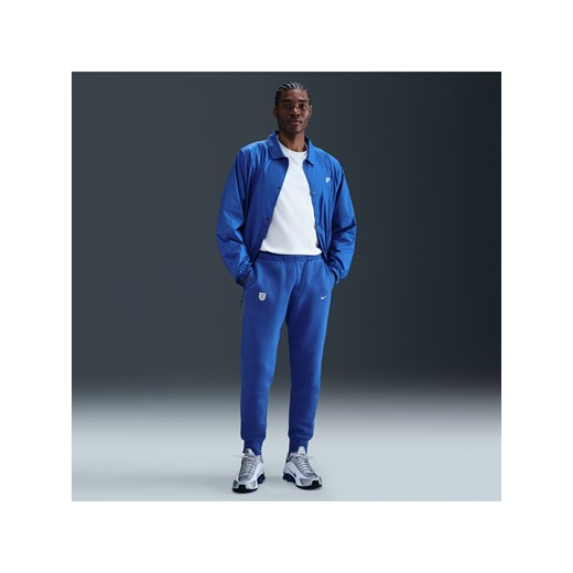 Męskie joggery piłkarskie Nike Anglia Club - Niebieski ze sklepu Nike poland w kategorii Spodnie męskie - zdjęcie 184007026