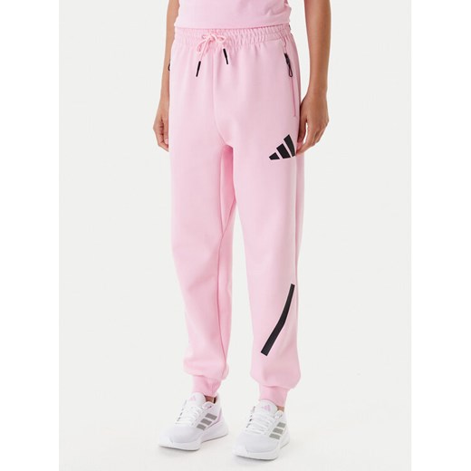 adidas Spodnie dresowe Z.N.E. JC5405 Różowy Regular Fit ze sklepu MODIVO w kategorii Spodnie damskie - zdjęcie 184007988