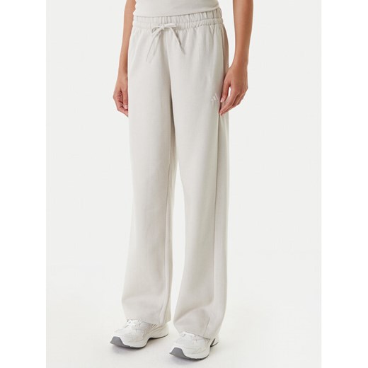 adidas Spodnie dresowe Essentials Small Logo Feel Cozy JC5922 Beżowy Regular Fit ze sklepu MODIVO w kategorii Spodnie damskie - zdjęcie 184009936