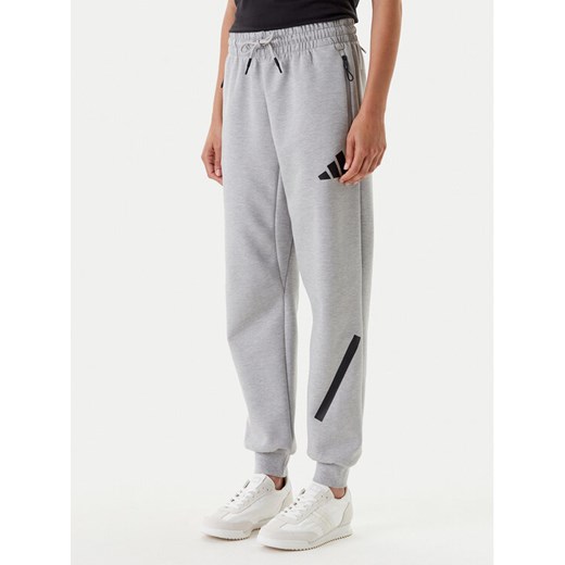 adidas Spodnie dresowe Z.N.E. JD9586 Szary Regular Fit ze sklepu MODIVO w kategorii Spodnie damskie - zdjęcie 184019258