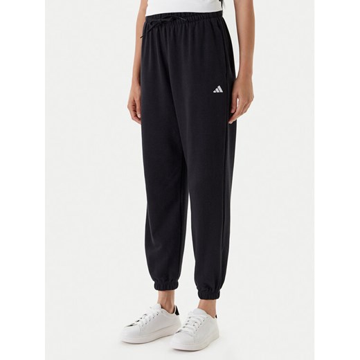 adidas Spodnie dresowe Essentials Small Logo JD7999 Czarny Loose Fit ze sklepu MODIVO w kategorii Spodnie damskie - zdjęcie 184019316