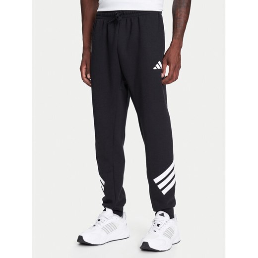adidas Spodnie dresowe Future Icons 3-Stripes JD4863 Czarny Regular Fit ze sklepu MODIVO w kategorii Spodnie męskie - zdjęcie 184019326