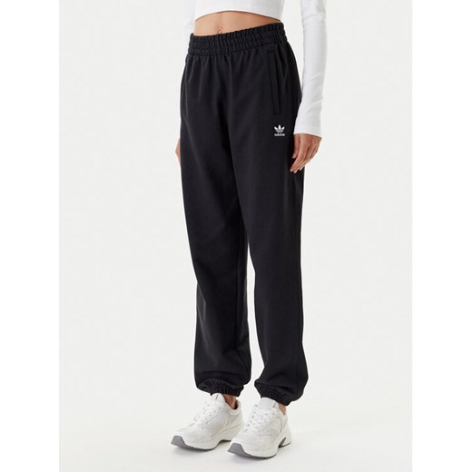 adidas Spodnie dresowe Essentials French Terry IW0952 Czarny Loose Fit ze sklepu MODIVO w kategorii Spodnie damskie - zdjęcie 184019407