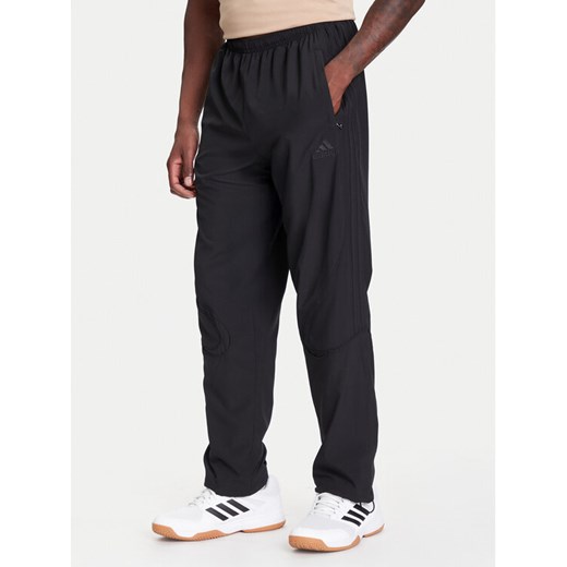 adidas Spodnie dresowe Teamgeist adicolor KA0596 Czarny Loose Fit ze sklepu MODIVO w kategorii Spodnie męskie - zdjęcie 184038417