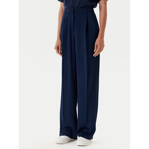 Tommy Hilfiger Spodnie materiałowe WW0WW46749 Granatowy Relaxed Fit ze sklepu MODIVO w kategorii Spodnie damskie - zdjęcie 184045595