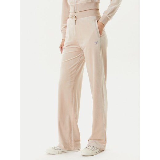 Guess Spodnie dresowe V3BB26 K0232 Beżowy Regular Fit ze sklepu MODIVO w kategorii Spodnie damskie - zdjęcie 184045755