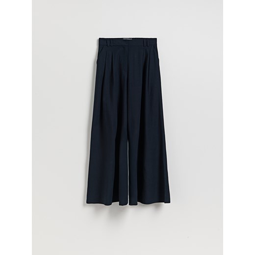 Reserved - Spodnie z szerokimi nogawkami - granatowy Reserved M Reserved