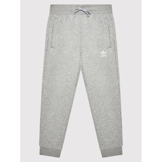 adidas Spodnie dresowe adicolor H32407 Szary Regular Fit ze sklepu MODIVO w kategorii Spodnie chłopięce - zdjęcie 184155448