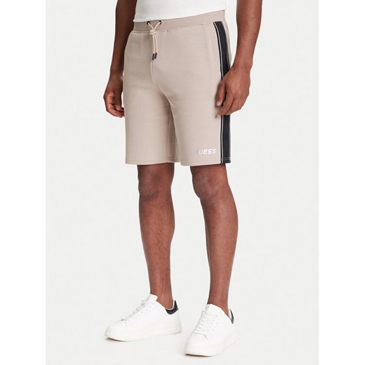 Guess Szorty sportowe Z4RD04 KB3P2 Beżowy Regular Fit ze sklepu MODIVO w kategorii Spodenki męskie - zdjęcie 184158625