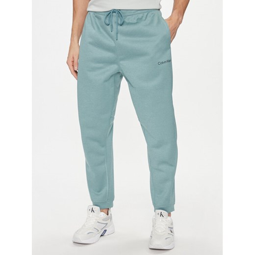 Calvin Klein Performance Spodnie dresowe 00GMF3P613 Niebieski Regular Fit ze sklepu MODIVO w kategorii Spodnie męskie - zdjęcie 184248445