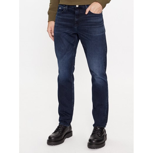 Tommy Jeans Jeansy Scanton DM0DM17438 Granatowy Slim Fit ze sklepu MODIVO w kategorii Jeansy męskie - zdjęcie 184250777