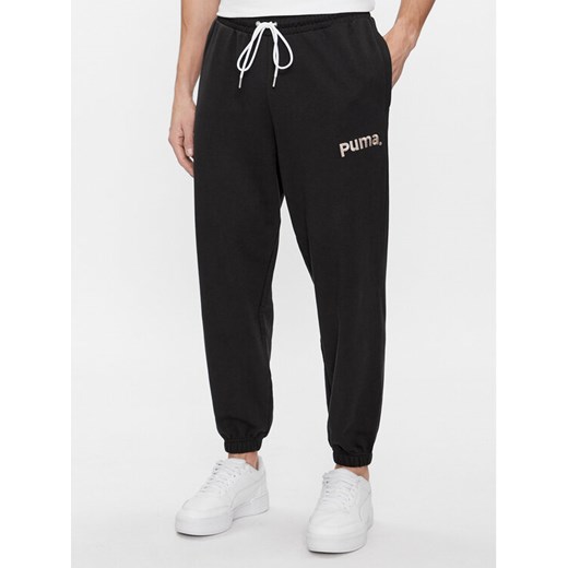 Puma Spodnie dresowe Team 538261 Czarny Relaxed Fit ze sklepu MODIVO w kategorii Spodnie męskie - zdjęcie 184261645
