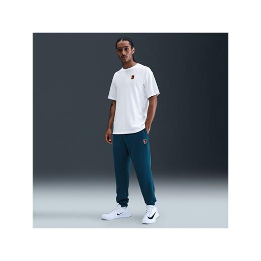 Męskie dzianinowe joggery do tenisa Dri-FIT NikeCourt Heritage - Niebieski ze sklepu Nike poland w kategorii Spodnie męskie - zdjęcie 184264315