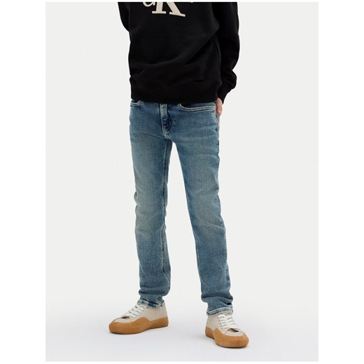 Calvin Klein Jeans Jeansy IB0IB02189 D Niebieski Slim Fit ze sklepu MODIVO w kategorii Spodnie chłopięce - zdjęcie 184282619