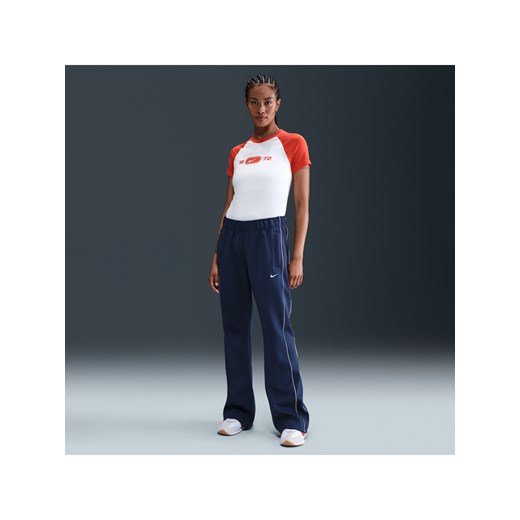 Damskie dopasowane spodnie z dzianiny ze średnim stanem Nike Sportswear Windrunner - Niebieski ze sklepu Nike poland w kategorii Spodnie damskie - zdjęcie 184284137