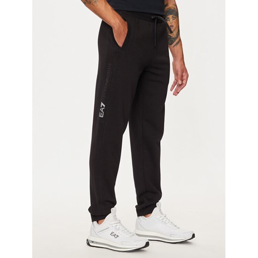 EA7 Emporio Armani Spodnie dresowe 6DPP58 PJVTZ 1200 Czarny Regular Fit ze sklepu MODIVO w kategorii Spodnie męskie - zdjęcie 184287928