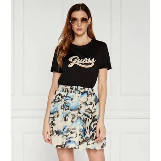 GUESS T-shirt GLITTERY LOGO | Regular Fit ze sklepu Gomez Fashion Store w kategorii Bluzki damskie - zdjęcie 184326577