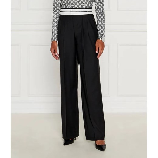 Marc Cain Spodnie chino | flare fit | z dodatkiem wełny ze sklepu Gomez Fashion Store w kategorii Spodnie damskie - zdjęcie 184506385