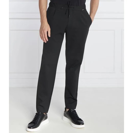 Calvin Klein Spodnie dresowe COMFORT KNIT PLEAT | Tapered fit ze sklepu Gomez Fashion Store w kategorii Spodnie męskie - zdjęcie 184509018