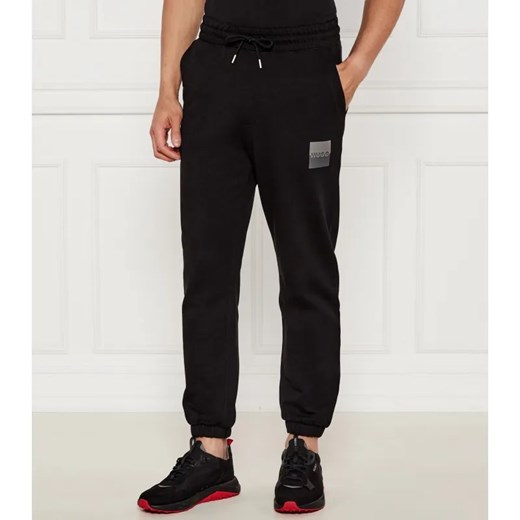 HUGO Spodnie dresowe Dusplitan | Loose fit ze sklepu Gomez Fashion Store w kategorii Spodnie męskie - zdjęcie 184516417