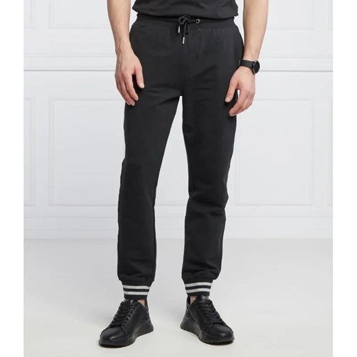 GUESS Spodnie dresowe Adam | Relaxed fit ze sklepu Gomez Fashion Store w kategorii Spodnie męskie - zdjęcie 184517756